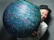 Kate Dwyer, 2024 Angel of the Arts with her art - photo credit Myron Gauger