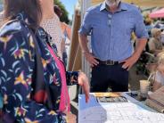 Councilmember Ben Thomas discussing Comprehensive Plan alternatives at the Farmers Market 2024