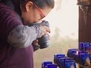 Woman taking photos of candles
