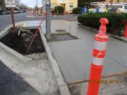 Finishing newly poured concrete on SW corner of Quincy and Washington Street (