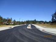 Street signs and striping are a sign that the project is almost complete