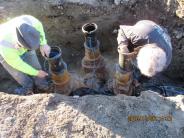 Crew members working on the installation of the 8" water main