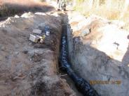 Crew members work on the installation of the 8" watermain