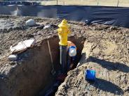 Crews continue installing the Joint Utility Trench down Howard St.