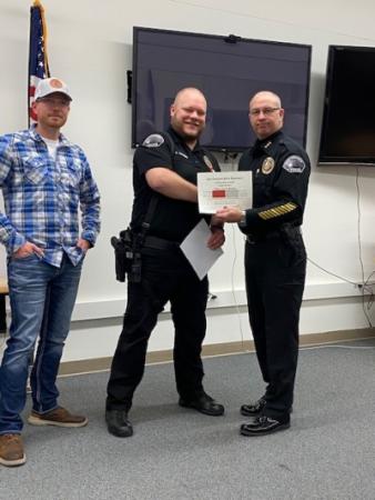 Officer Hansen receiving award