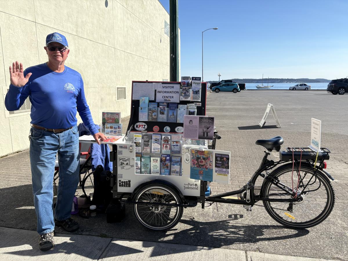 Mobile Greeter with e-bike cart on Water Street Mobile Greeter with e-bike cart on Water Street